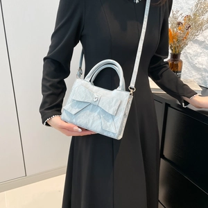 Elegant ice blue bow handbag with heart crystal and marble texture for women