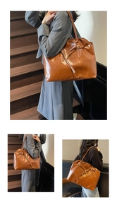 Detail of caramel brown leather tote bag with tie decoration for office and daily commute