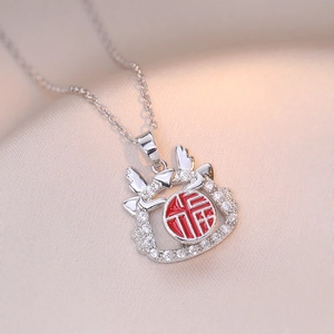 Minimalist silver-tone necklace with Fu character pendant and sparkling zircon details