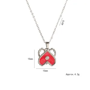 Elegant silver heart pendant necklace with red wavy border and sparkling zircon center