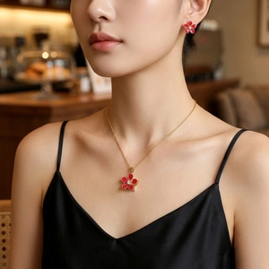 Elegant red flower jewelry set with spinning zircon necklace and matching gold earrings
