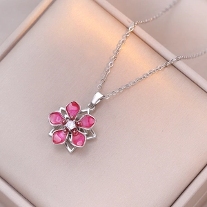 Elegant rotating pink enamel cherry blossom pendant necklace with zircon on velvet case