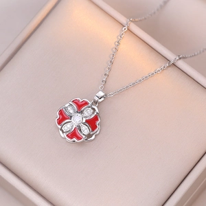 Rotating red flower pendant necklace in stainless steel with sparkling cubic zirconia