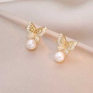 Elegant gold butterfly earrings with cubic zirconia inlay and white freshwater pearls