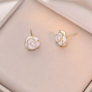 Elegant white camellia stud earrings with freshwater pearls on a gold-plated frame