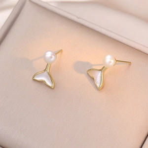 Elegant gold mermaid tail earrings with white freshwater pearl and mother-of-pearl inlay