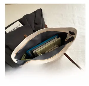 Top view of spacious cream tote bag interior showing capacity for tablet and umbrella