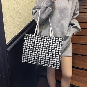Classic black and white houndstooth tote bag with large capacity and white shoulder straps