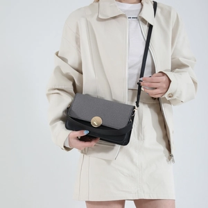 Fashionable grey fabric and black leather crossbody bag with gold round metal buckle