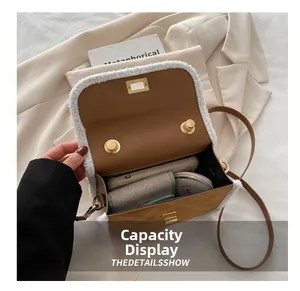 Macro detail of brown suede crossbody bag with fleece lining and large storage capacity