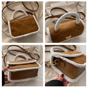 Detail view of brown quilted suede bag with fuzzy sherpa trim and golden lock