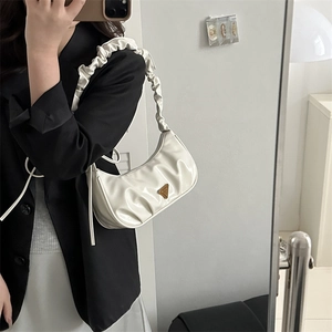 Fashionable white pleated half-moon shoulder bag with a stylish scrunchie strap design
