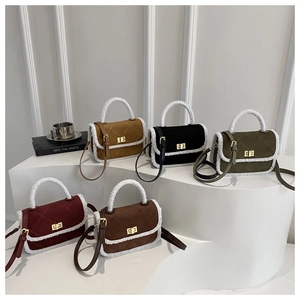 Five elegant quilted small square bags with plush trim in various colors on display