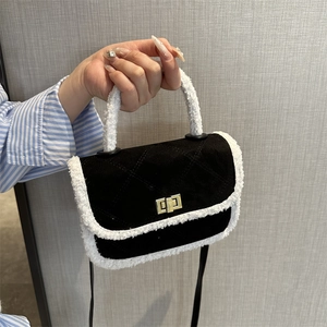Quilted black bag with white faux fur trim and gold twist lock for women