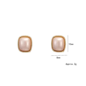 Elegant 10mm geometric white earrings with champagne pink core and golden bead border