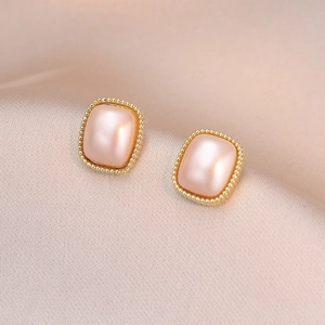Elegant gold square stud earrings with pink satin finish inlay on luxury silk cloth