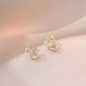 Floral S925 silver earrings with freshwater pearls and sparkling zircons on gold metal
