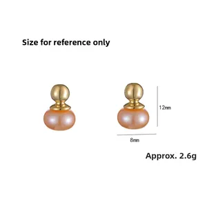 Detailed view of gold ball earrings with pink freshwater pearls and 12mm size dimensions
