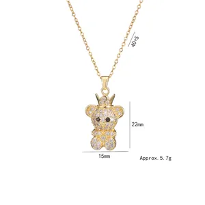 Golden crown bear necklace with sparkling white zircon pavé setting and black stone eyes