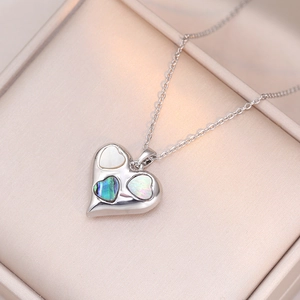Elegant heart pendant necklace with shell inlay on a delicate silver chain
