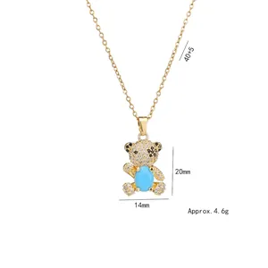 Gold bear pendant necklace with blue turquoise and sparkling crystals, 20x14mm size
