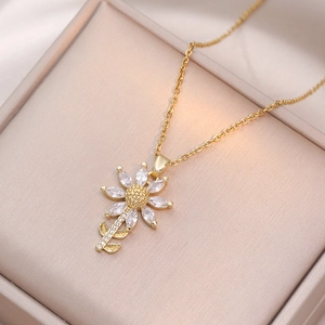 Elegant gold sunflower necklace with sparkling zircon petals on champagne velvet box