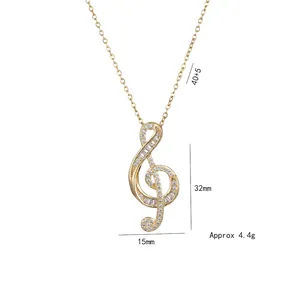 Golden treble clef musical note necklace with white zircon pavé and adjustable chain