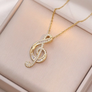 Golden musical note necklace with sparkling zircon pavé in a premium jewelry gift box