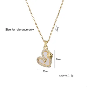 Collier cœur doré avec incrustation de nacre, pierres en zircon et pendentif smiley