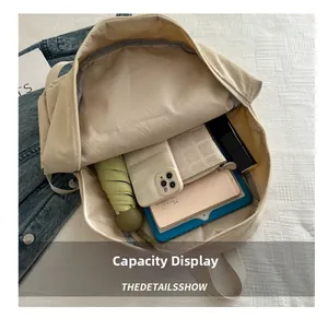 Internal layout of large beige backpack showing storage for tablet, umbrella and wallet