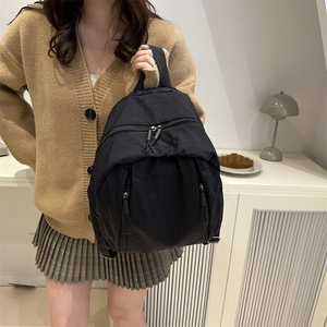 Classic black nylon backpack for students featuring multi-pocket design and large capacity