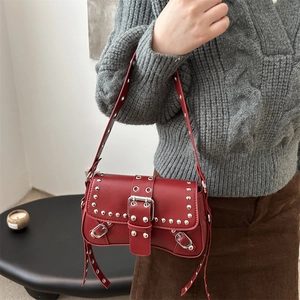 Vintage red rivet shoulder bag for women with punk metal studs and buckle detail