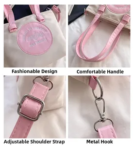 Détails du sac seau bicolore rose avec bandoulière réglable et boucles en métal
