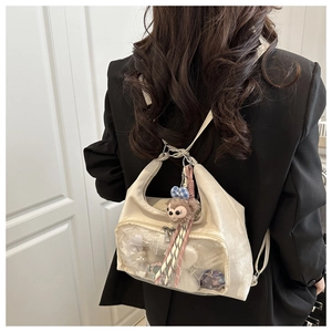 Detail view of large capacity ita bag with transparent window for anime badges and dolls