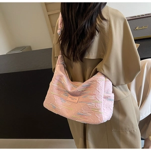 Pink jacquard canvas tote bag with geometric embroidery and adjustable strap detail