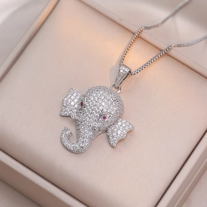 Silver elephant pendant necklace with shimmering zircon pavé stones and red gemstone eyes