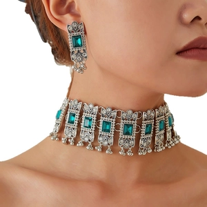 Vintage emerald green gemstone jewelry set with bohemian silver choker and long earrings
