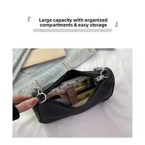 Top view of black textured shoulder bag interior showing large storage capacity