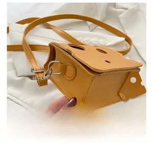 Close-up of precise stitching and side structure of cheese-shaped crossbody bag
