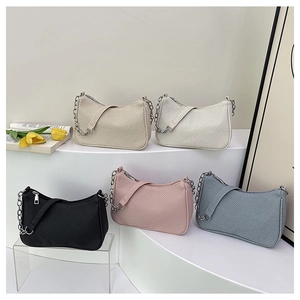 Collection of textured crossbody bags in five colors with silver chain details