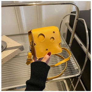 Creative yellow cheese-shaped mini crossbody bag with unique holes and leather texture