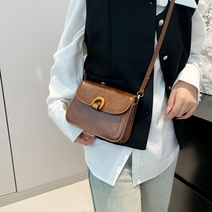 Retro dark brown crossbody bag with glossy oil wax leather and gold horsehoof buckle