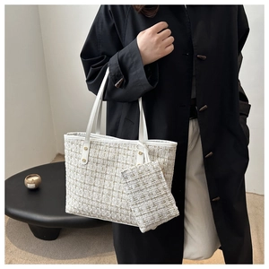 Detail of tweed tote bag and matching mini pouch with gold metallic woven textures