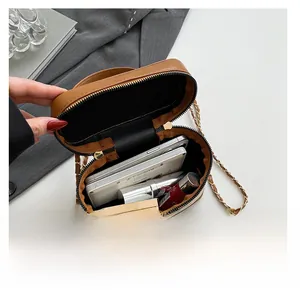 Internal view of the printed box bag showing capacity for phone and cosmetics