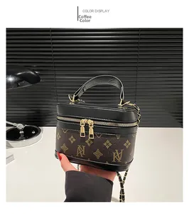 Detail of vintage box vanity bag in brown monogram canvas with gold chain strap