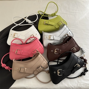 Retro half-moon underarm bag in seven colors with decorative metal buckles and knotted straps