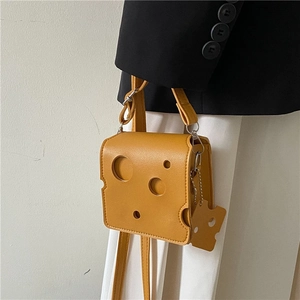 Yellow cheese-shaped mini crossbody bag with creative hole design and small pendant