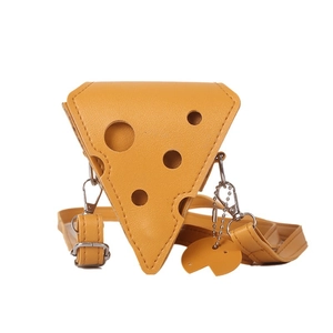 Creative yellow cheese-shaped crossbody bag with adjustable strap and matching mini charm