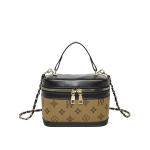 Retro monogram cylinder bucket bag with leather handle and golden chain shoulder strap