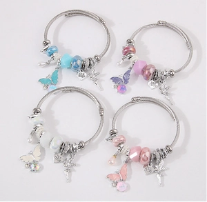 Four colorful charm bracelet sets with butterfly, fairy pendants and I Love MOM heart charms